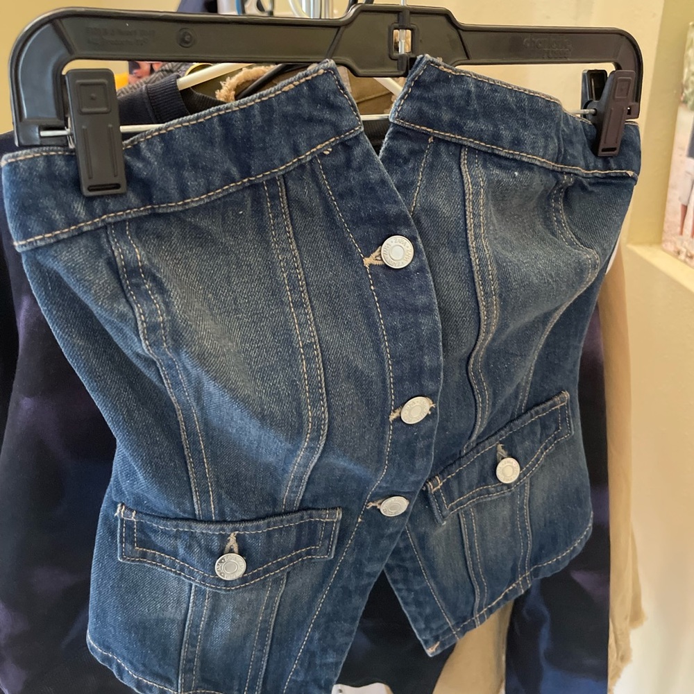 Strapless button vest top. Runs small new with tags. Perfect top for the summer!